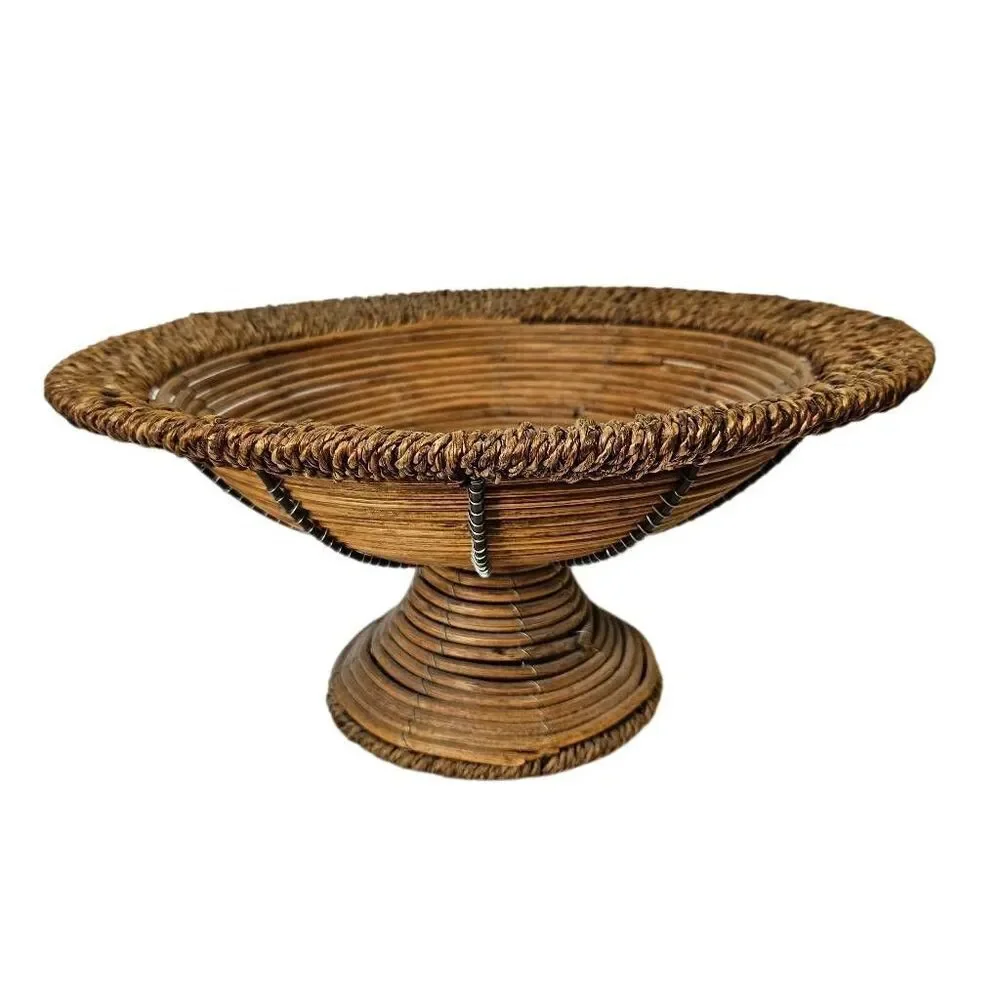 Handwoven vintage wicker ratton pedestal bowl/basket with footed base.